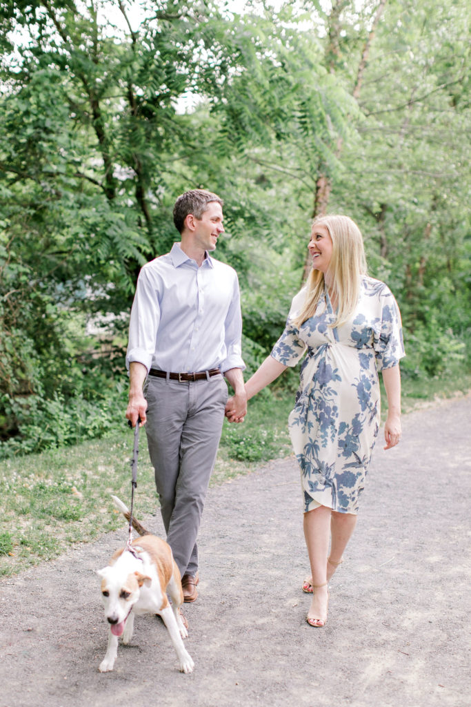 couple expecting baby with dog maternity photos