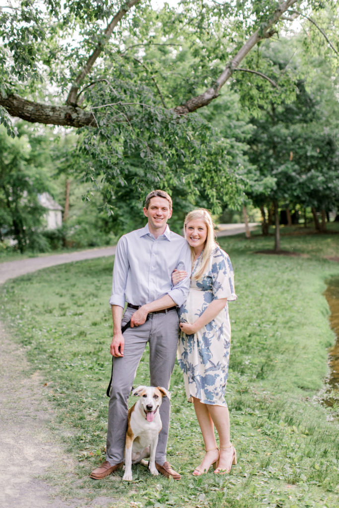 couple expecting baby with dog maternity photography