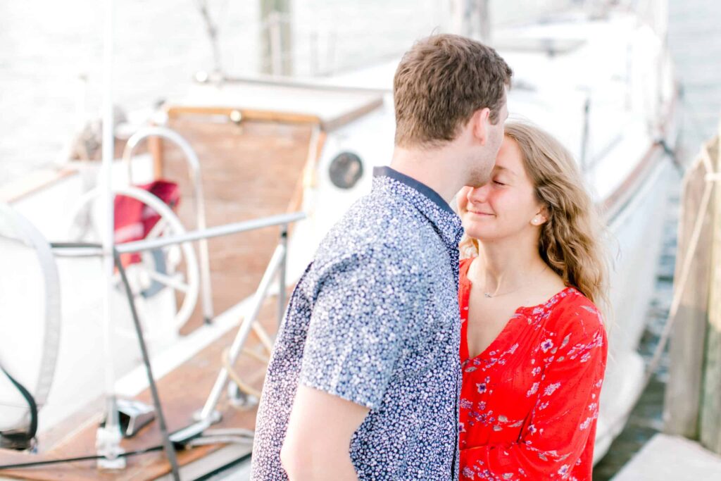 Beautiful romantic couple portrait by Nikki Schell Photography at the marina.