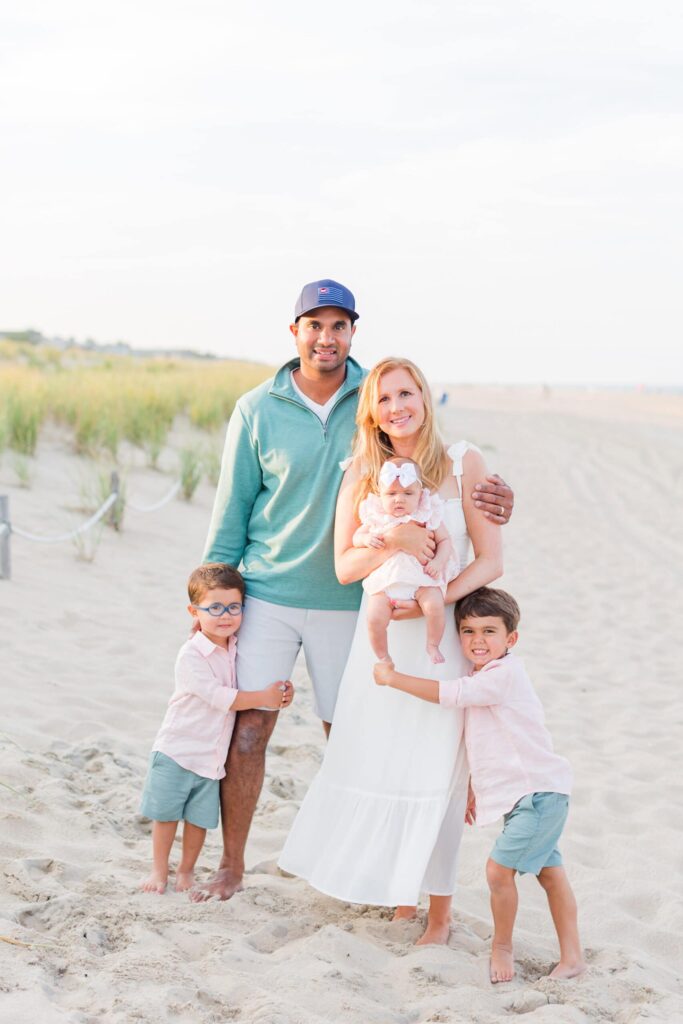 Family beach portrait with children, capturing memorable moments, outdoor photography, professional family photos, Nikki Schell.