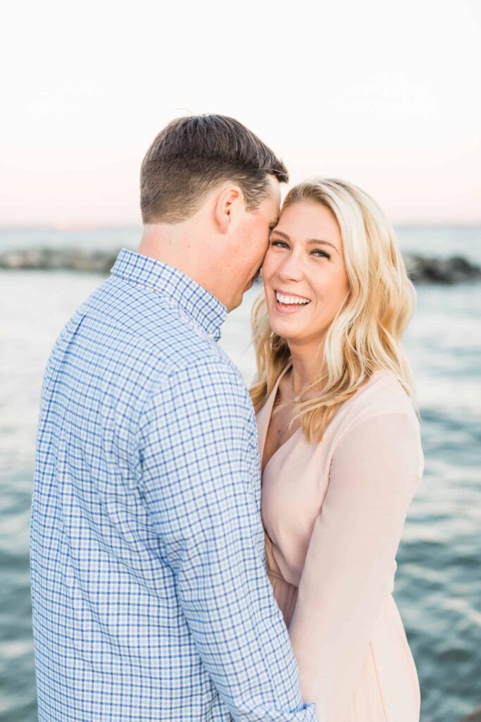 Beautiful engagement photos by Nikki Schell Photography, capturing love and happiness by the water.