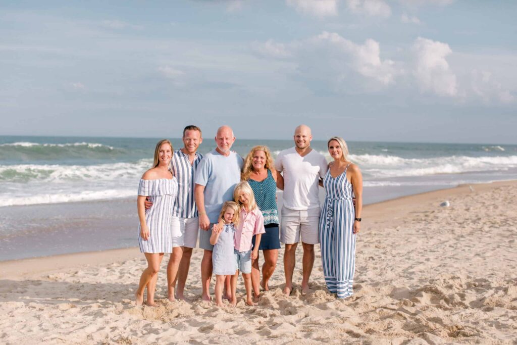 Beautiful family photo on the beach, capturing joyful moments with professional photographer.